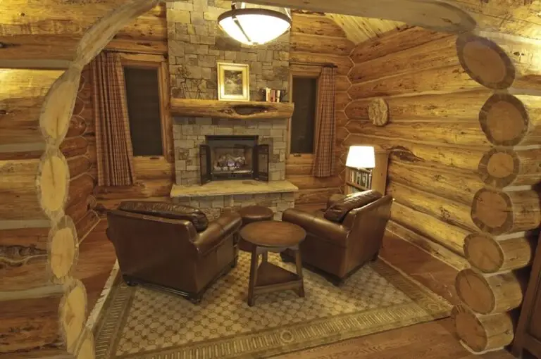 Log home great room and living area with exposed logs — photo 27