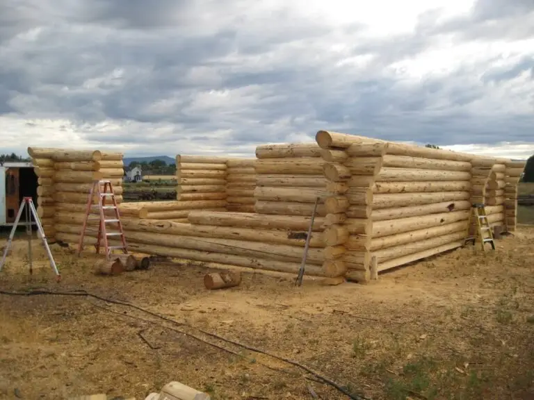 Custom log home under construction by Frontier Log Homes general contractor — photo 27
