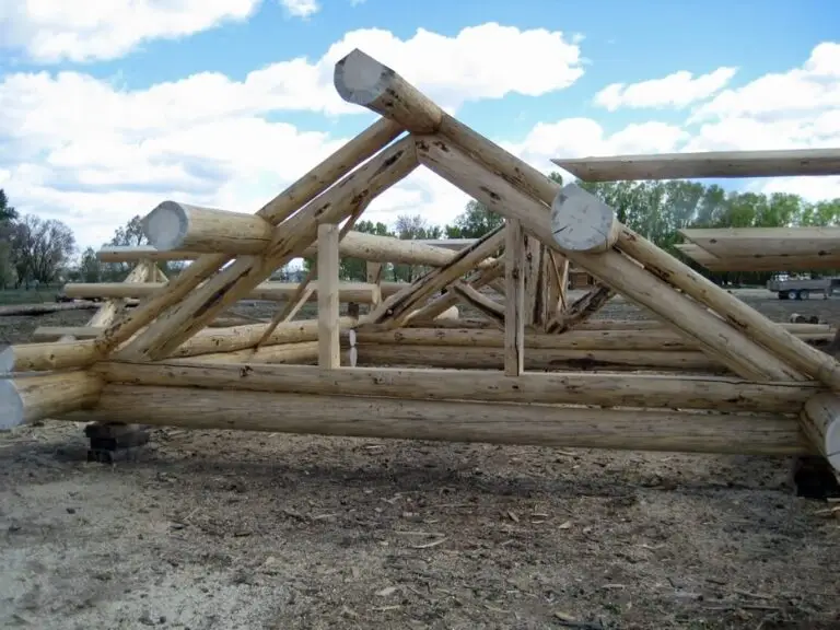 Custom log home under construction by Frontier Log Homes general contractor — photo 26