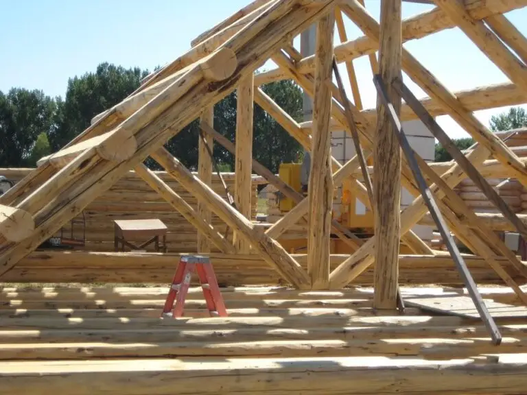Custom log home under construction by Frontier Log Homes general contractor — photo 23