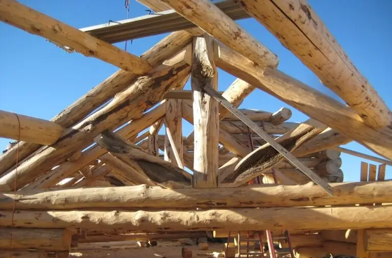 Custom log home under construction by Frontier Log Homes general contractor — photo 22