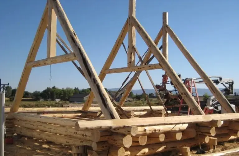 Custom log home under construction by Frontier Log Homes general contractor — photo 21