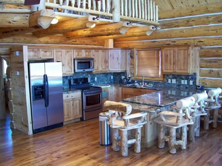 Log home kitchen and dining area in a custom build — photo 31