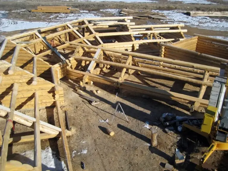 Custom log home under construction by Frontier Log Homes general contractor — photo 20