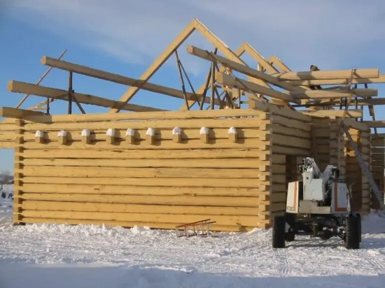 Custom log home under construction by Frontier Log Homes general contractor — photo 19