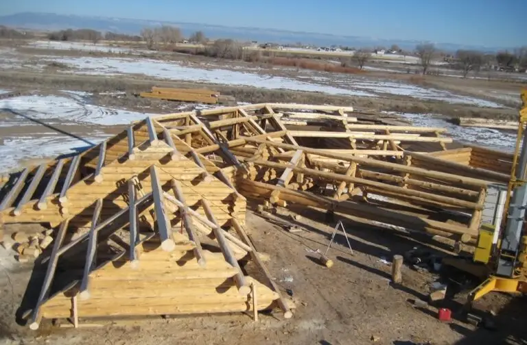 Custom log home under construction by Frontier Log Homes general contractor — photo 18
