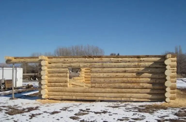 Custom log home under construction by Frontier Log Homes general contractor — photo 16