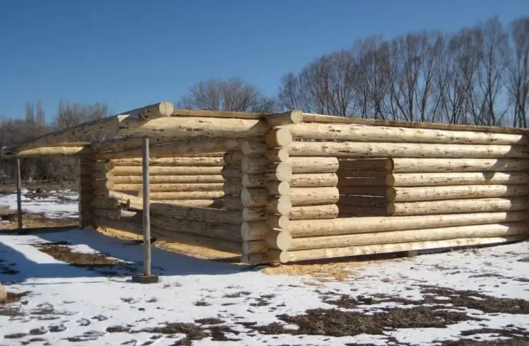 Custom log home under construction by Frontier Log Homes general contractor — photo 15