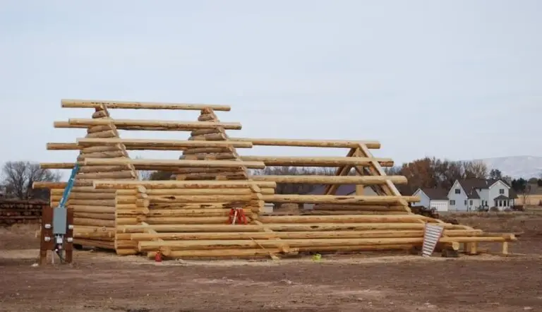 Custom log home under construction by Frontier Log Homes general contractor — photo 13