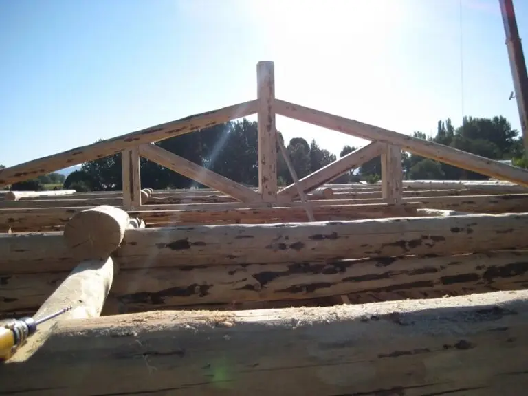 Custom log home under construction by Frontier Log Homes general contractor — photo 11