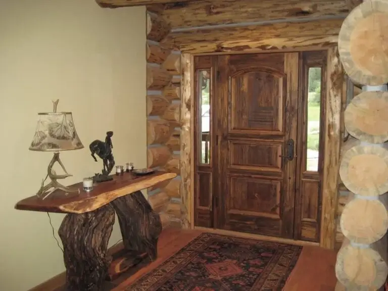 Log cabin interior of a handcrafted custom log home — photo 40