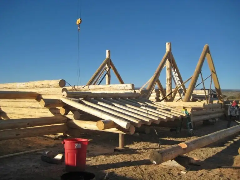 Custom log home under construction by Frontier Log Homes general contractor — photo 9