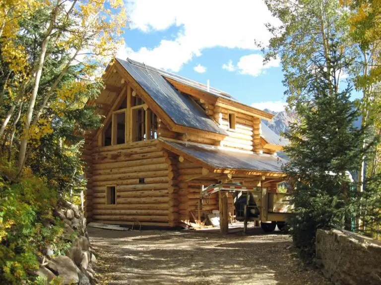 Custom log home under construction by Frontier Log Homes general contractor — photo 8