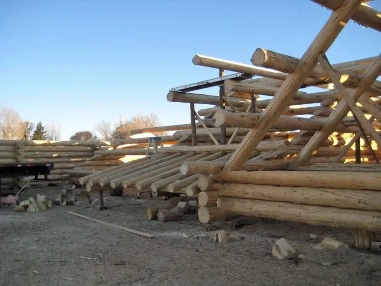 Dry-in log home package — weather-tight handcrafted log shell by Frontier Log Homes