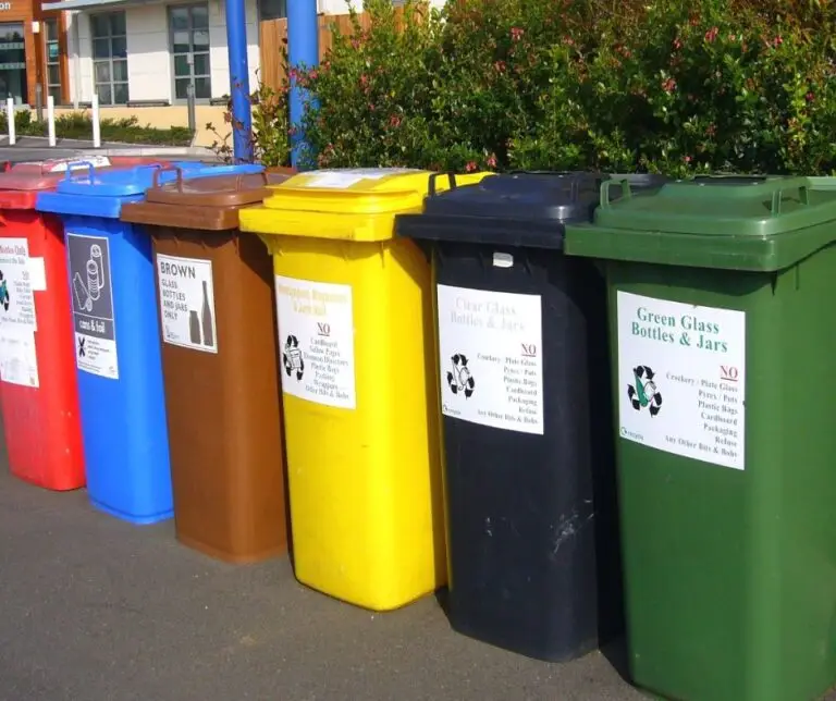 Recycled materials sorted into bins for use in eco-friendly log home construction