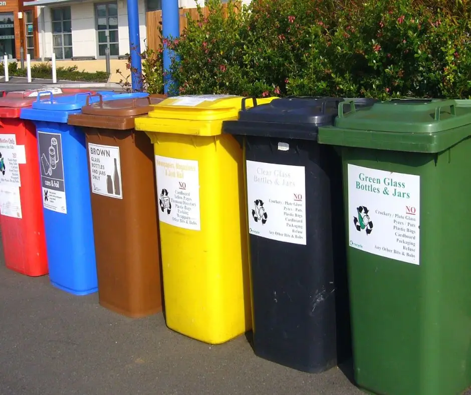Recycled materials sorted into bins for use in eco-friendly log home construction