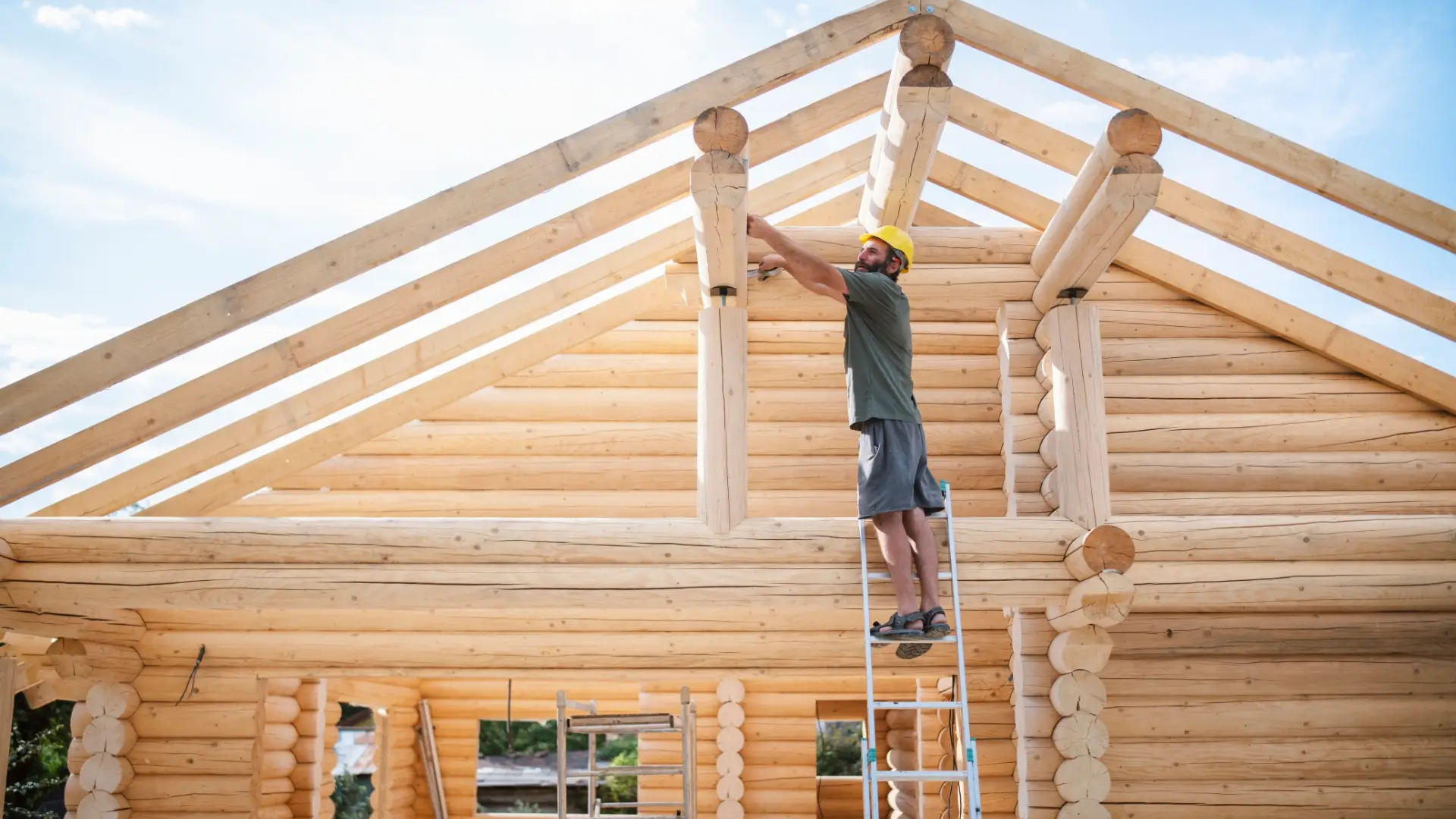 General contractor Colorado crew framing a custom log home on Colorado's Western Slope