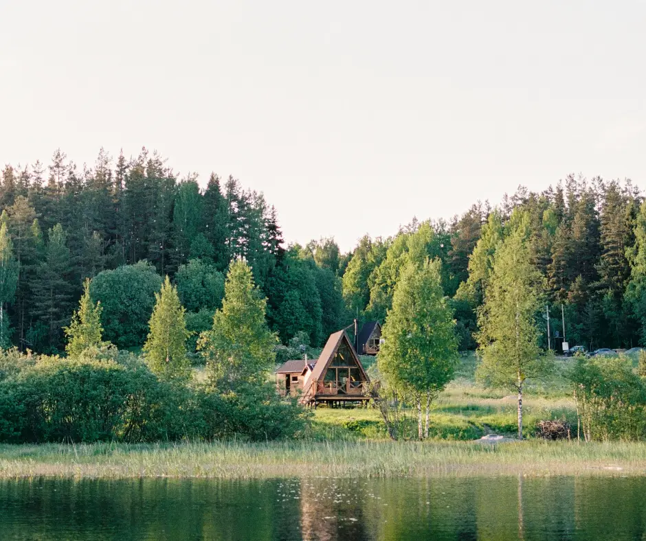 Small log cabin kits by Frontier Log Homes tucked in the Colorado pines